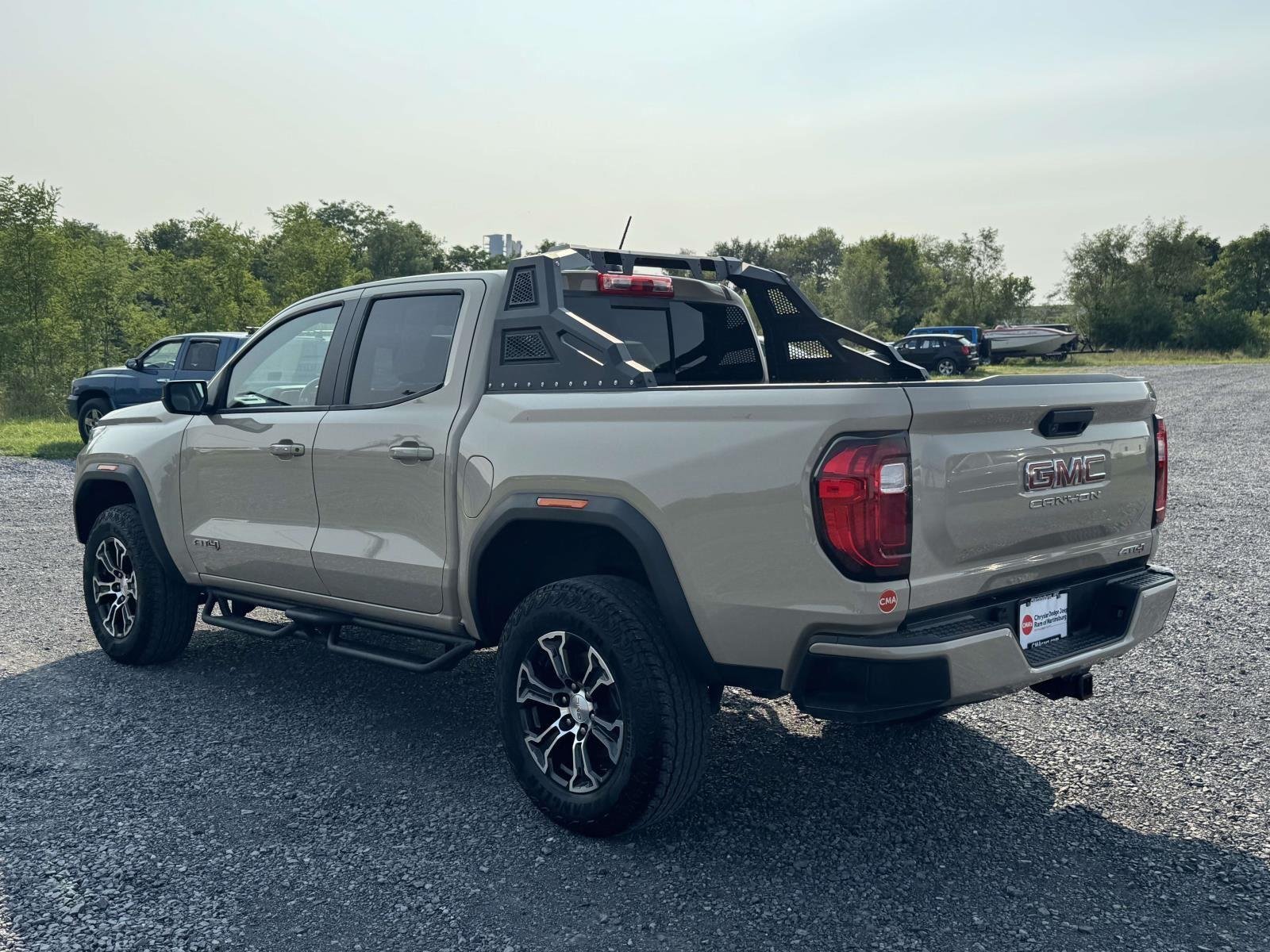 Used 2023 Desert Sand Metallic GMC 4WD AT4 image 24
