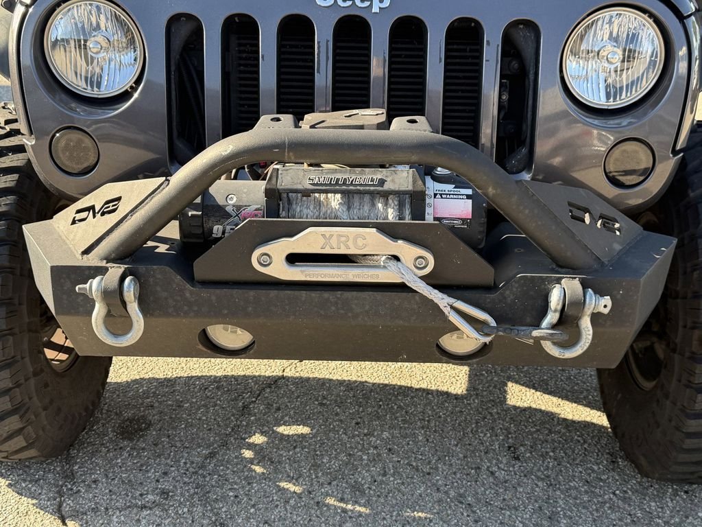 Used 2016 Granite Crystal Clearcoat Metallic Jeep Unlimited Sport image 10