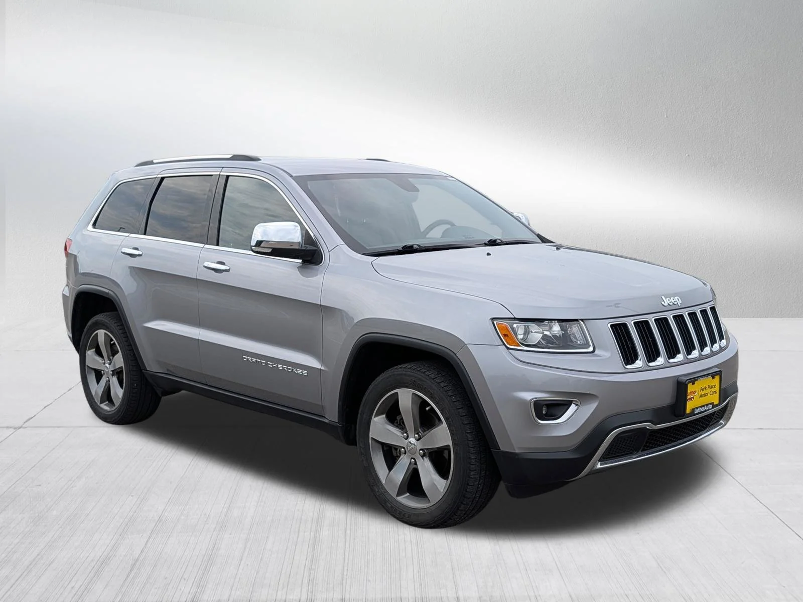 Used 2014 Billet Silver Metallic Clearcoat Jeep Limited image 1