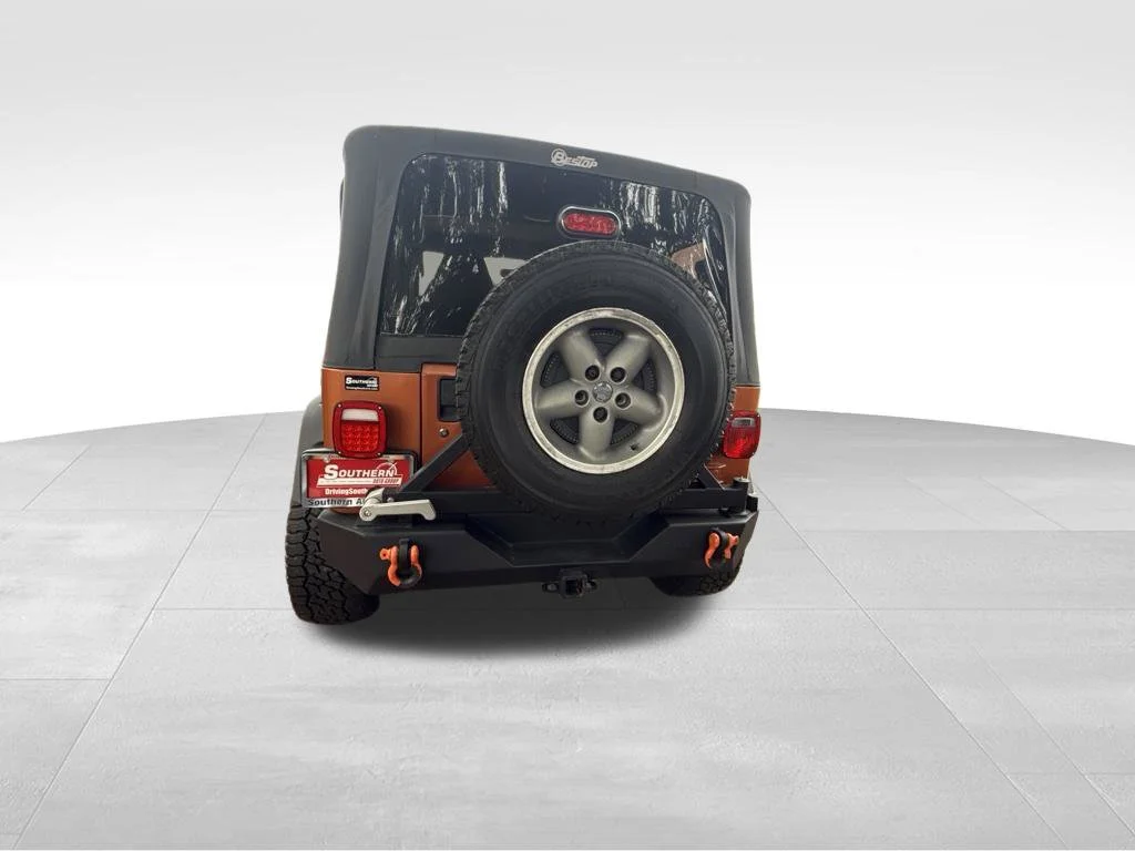 Used 2000 Orange Jeep Sport image 4