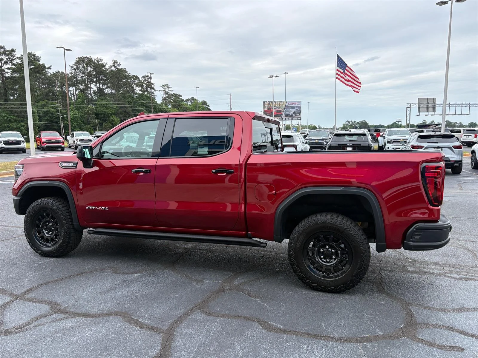 Used 2026 Volcanic Red Tintcoat GMC AT4X image 15