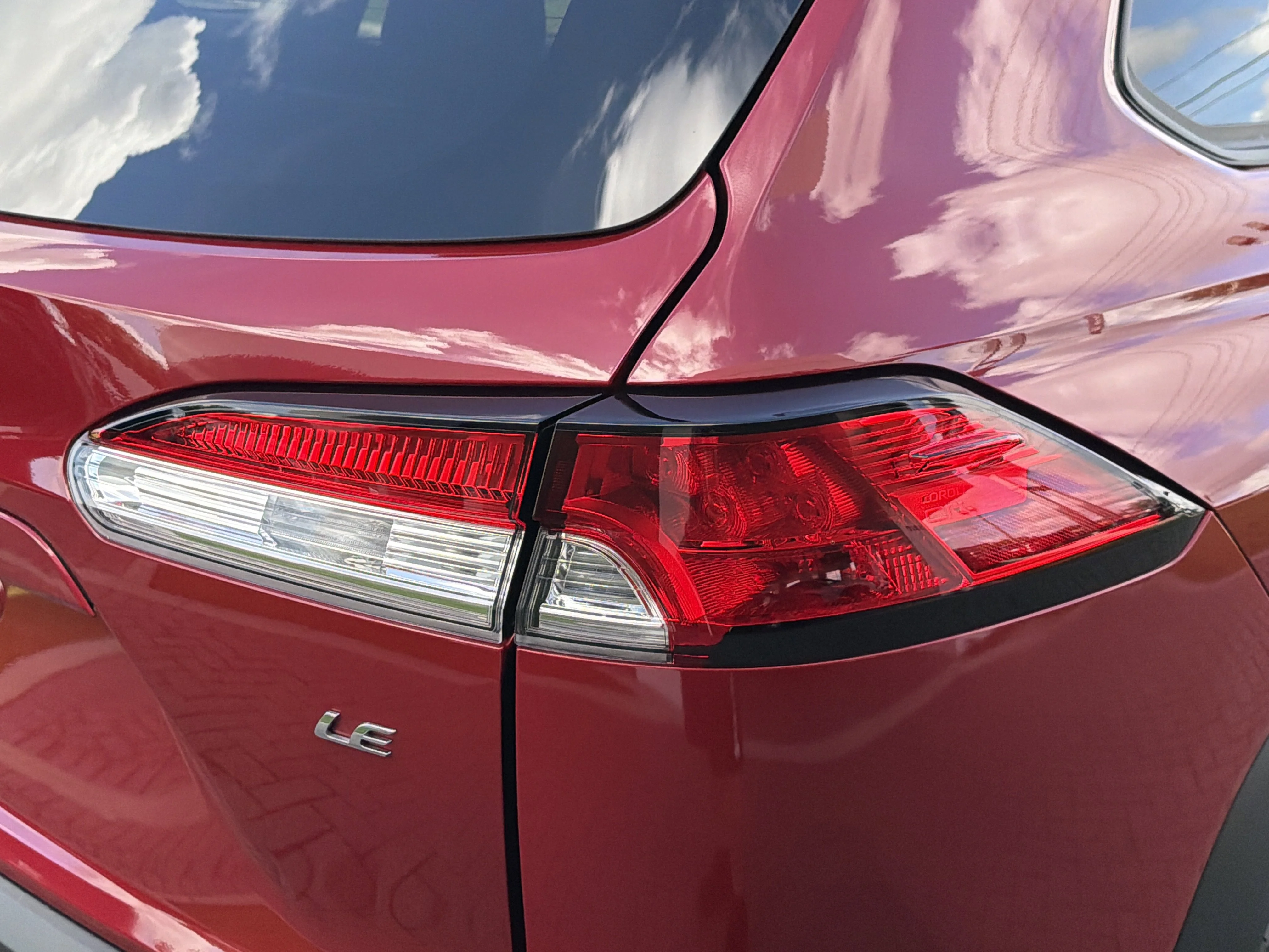 Used 2023 Barcelona Red Metallic Toyota LE image 10