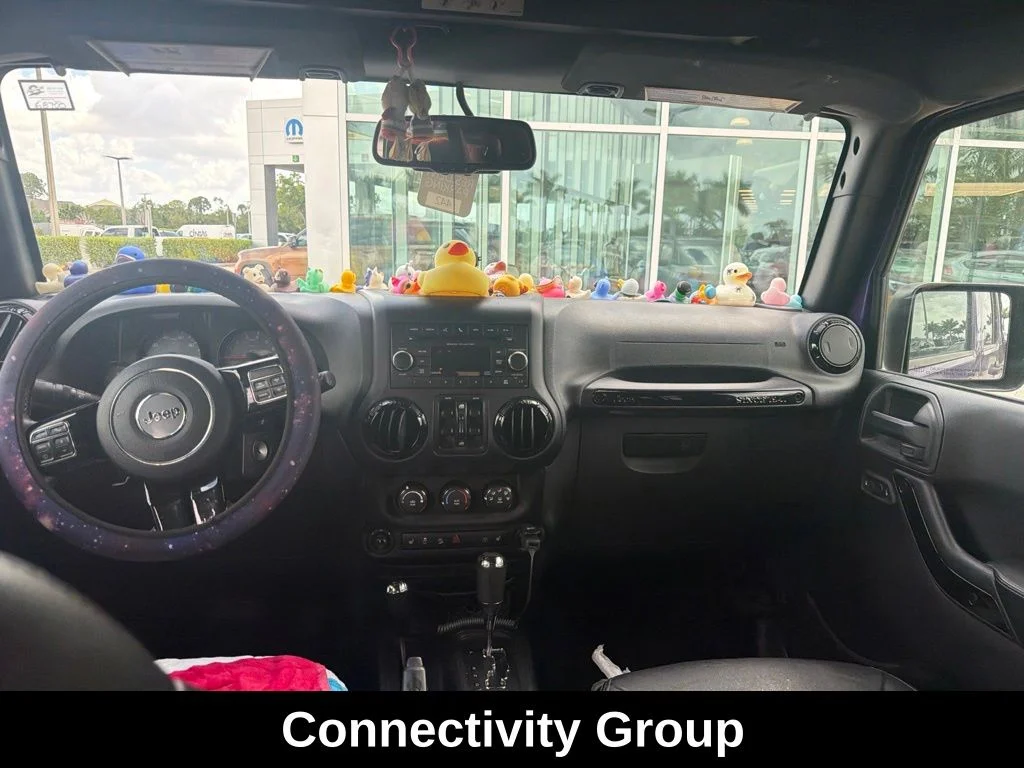 Certified Used 2016 Purple Jeep Unlimited Sahara image 4