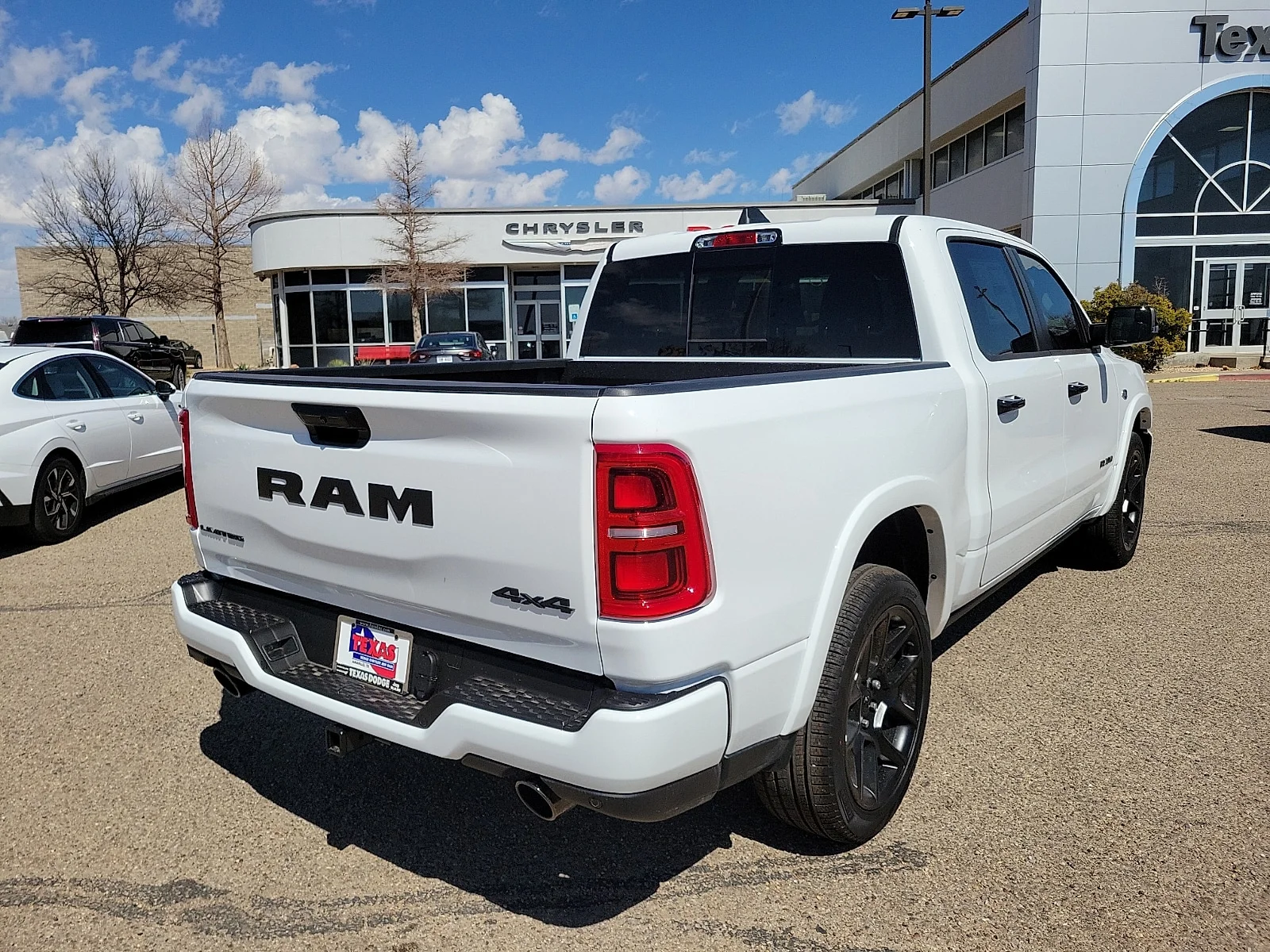 New 2026 Bright White Ram LIMITED CREW CAB 4X4 5