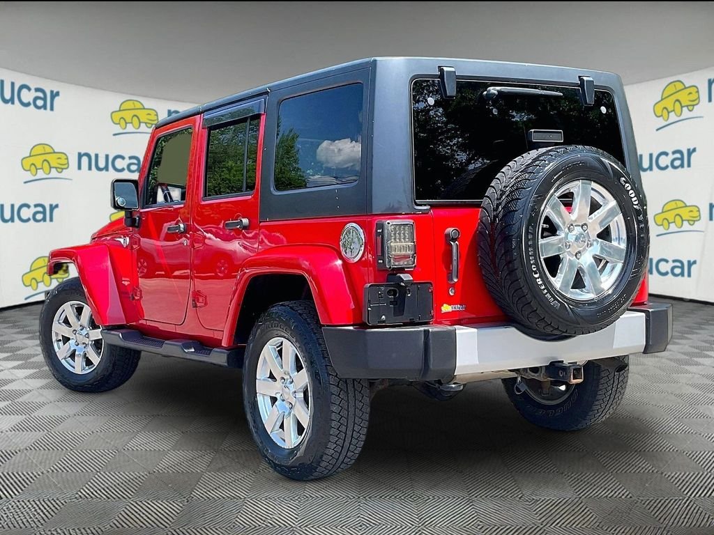 Used 2015 Red Jeep Unlimited Sahara image 4