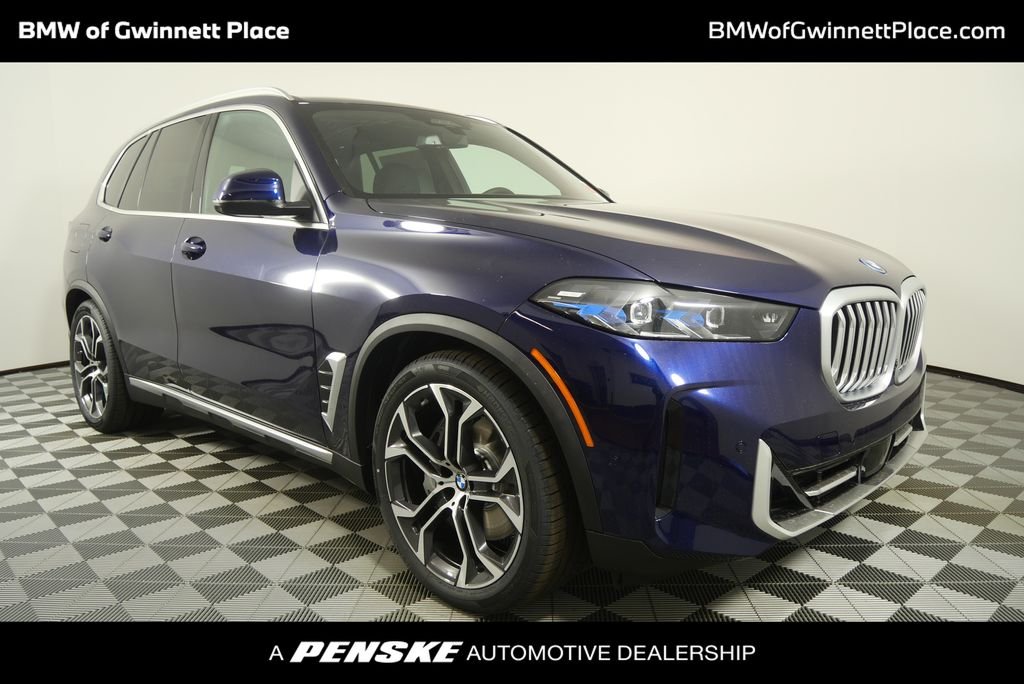 New 2026 Tanzanite Blue II Metallic BMW xDrive50e image 1