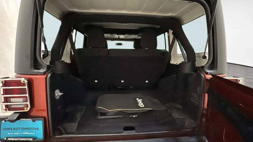 Used 2014 Orange Jeep Unlimited Sport image 11