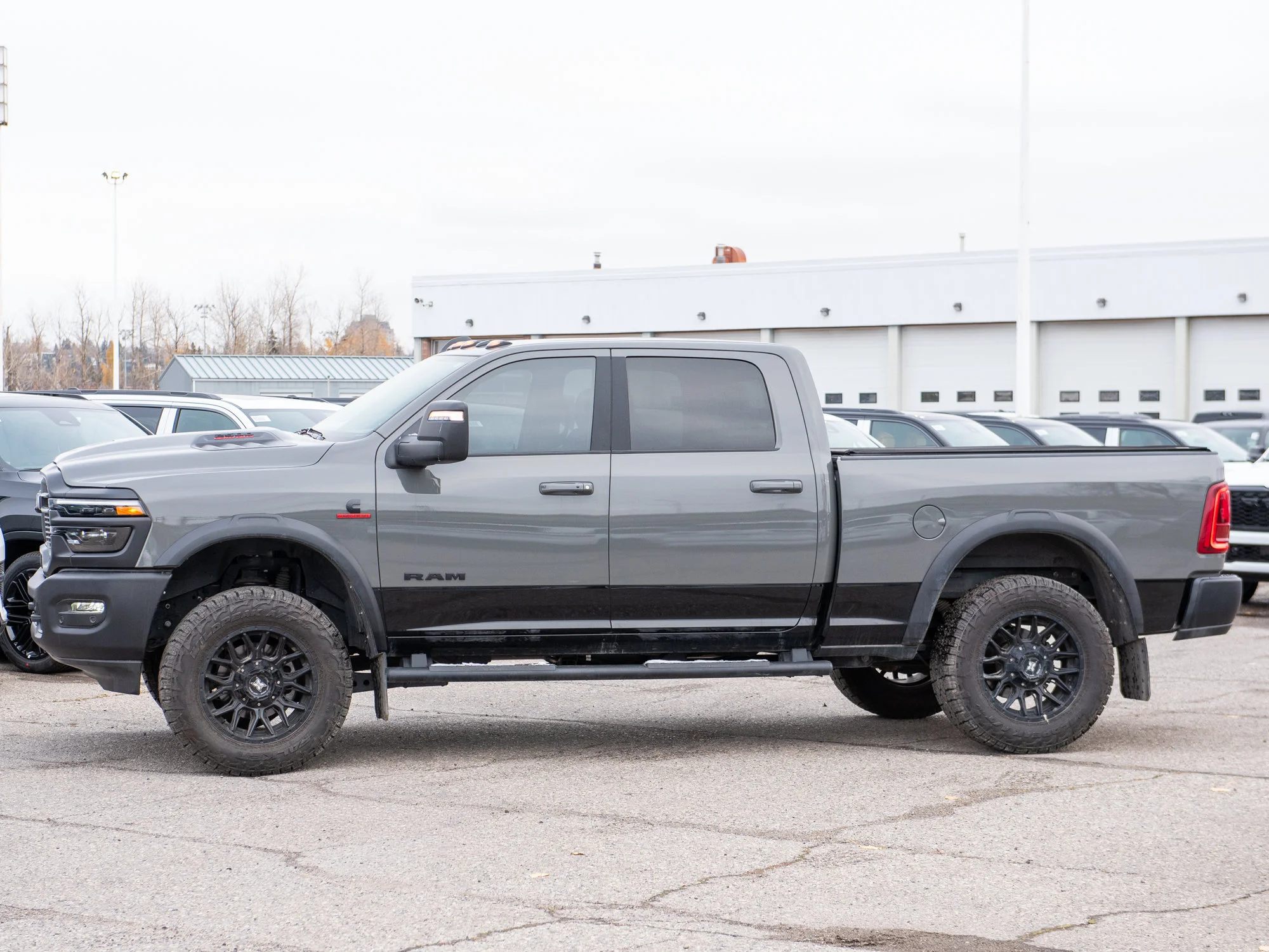 Used 2026 Grey RAM Rebel* Crew Cab 4x4, 2 Inch Lift, 35 Inch Tires, Winch, Trigger Industries MudFlaps image 3