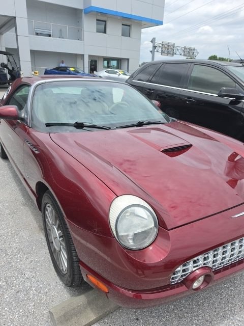 Used 2004 Red Ford Deluxe image 1