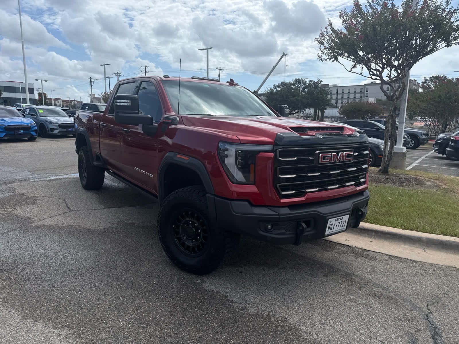 Used 2025 Volcanic Red Tintcoat GMC AT4X image 3