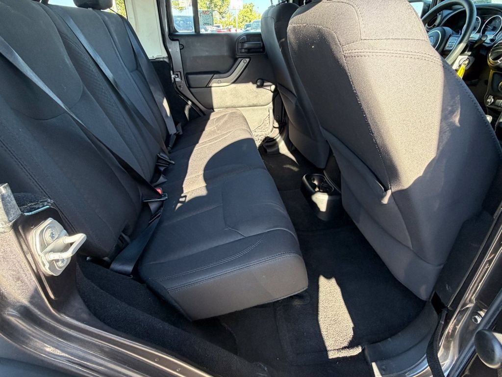 Used 2016 Granite Crystal Clearcoat Metallic Jeep Unlimited Sport image 17