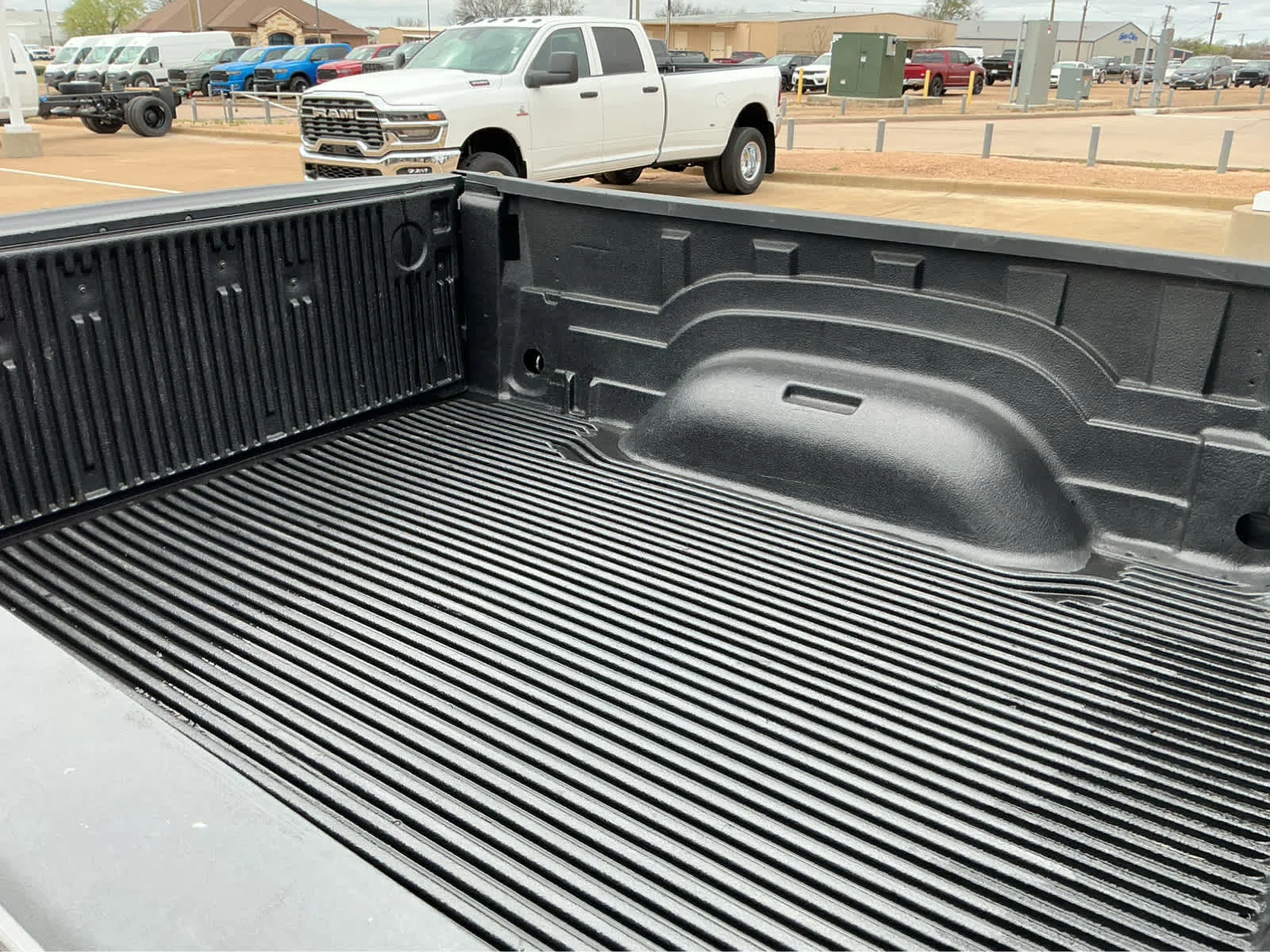 Used 2024 Granite Crystal Metallic Clearcoat Ram SLT image 7