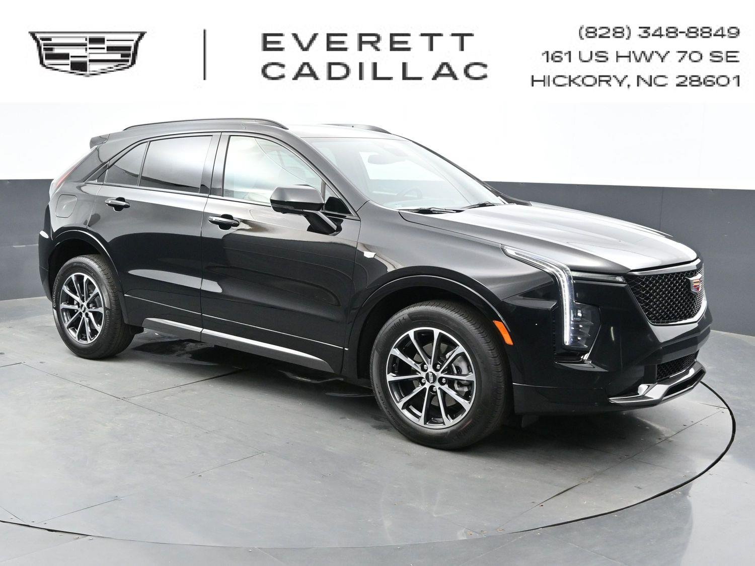 Used 2024 Stellar Black Metallic Cadillac Sport image 1