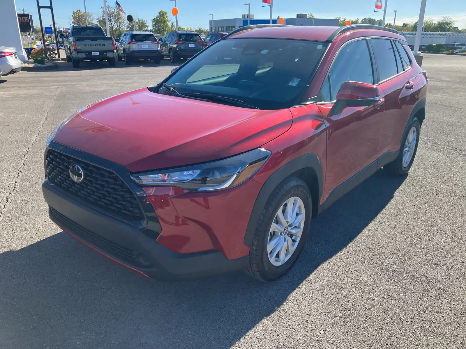 Used 2023 Barcelona Red Metallic Toyota LE image 3