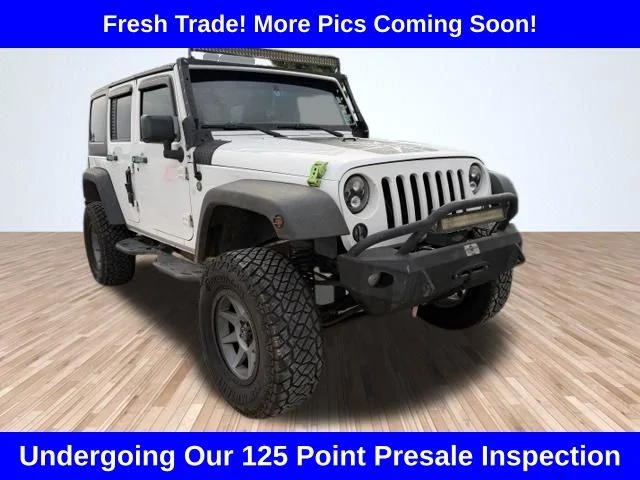 Used 2015 White Jeep Unlimited Sport image 1