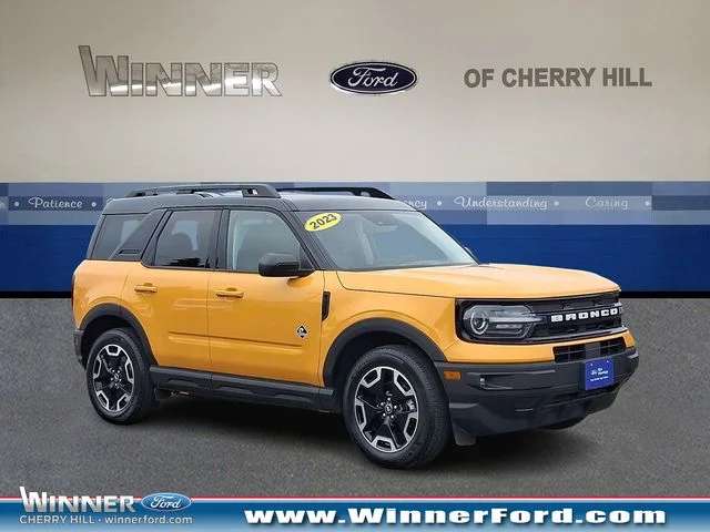 Certified Used 2023 Cyber Orange Metallic Tricoat Ford Outer Banks image 1