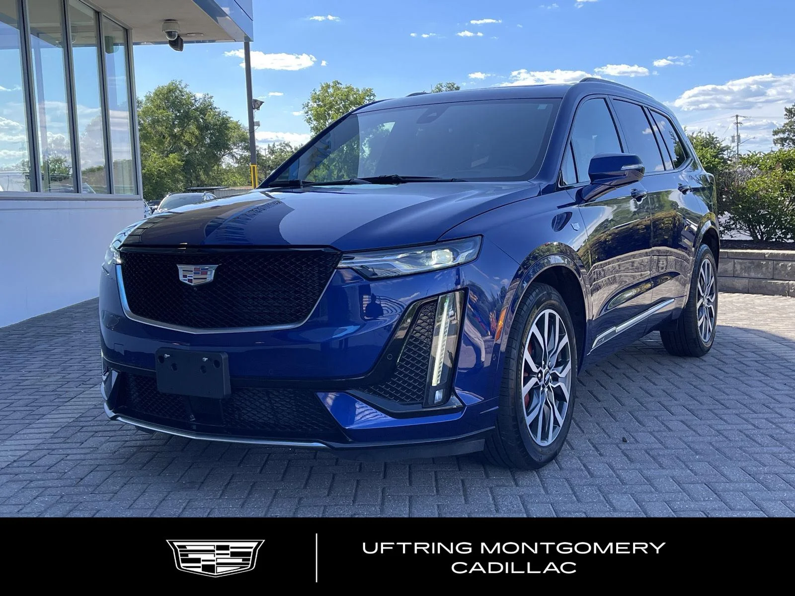 Used 2024 Opulent Blue Metallic Cadillac Sport image 1