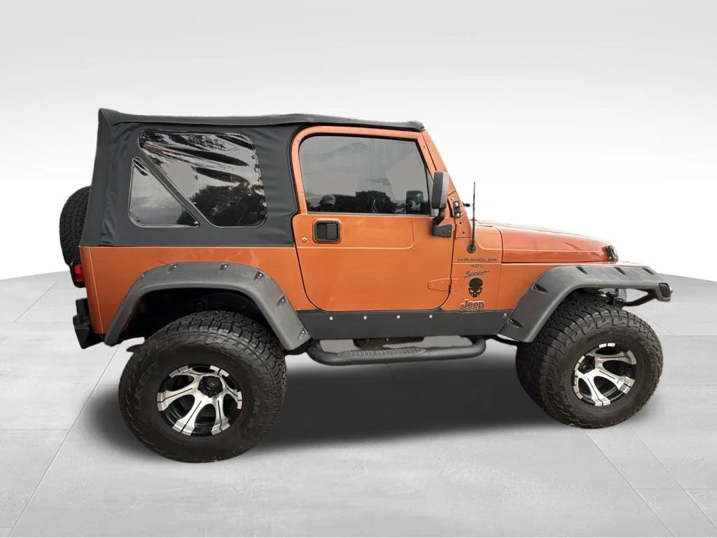 Used 2000 Orange Jeep Sport image 6