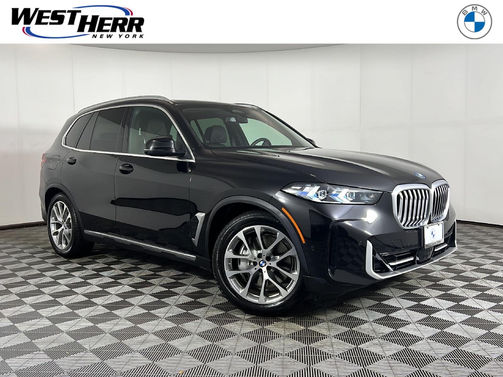 New 2026 Black Sapphire Metallic BMW xDrive50e image 1