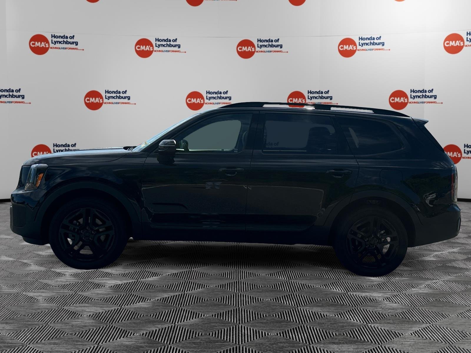 Used 2025 Ebony Black Kia EX X-Line image 2