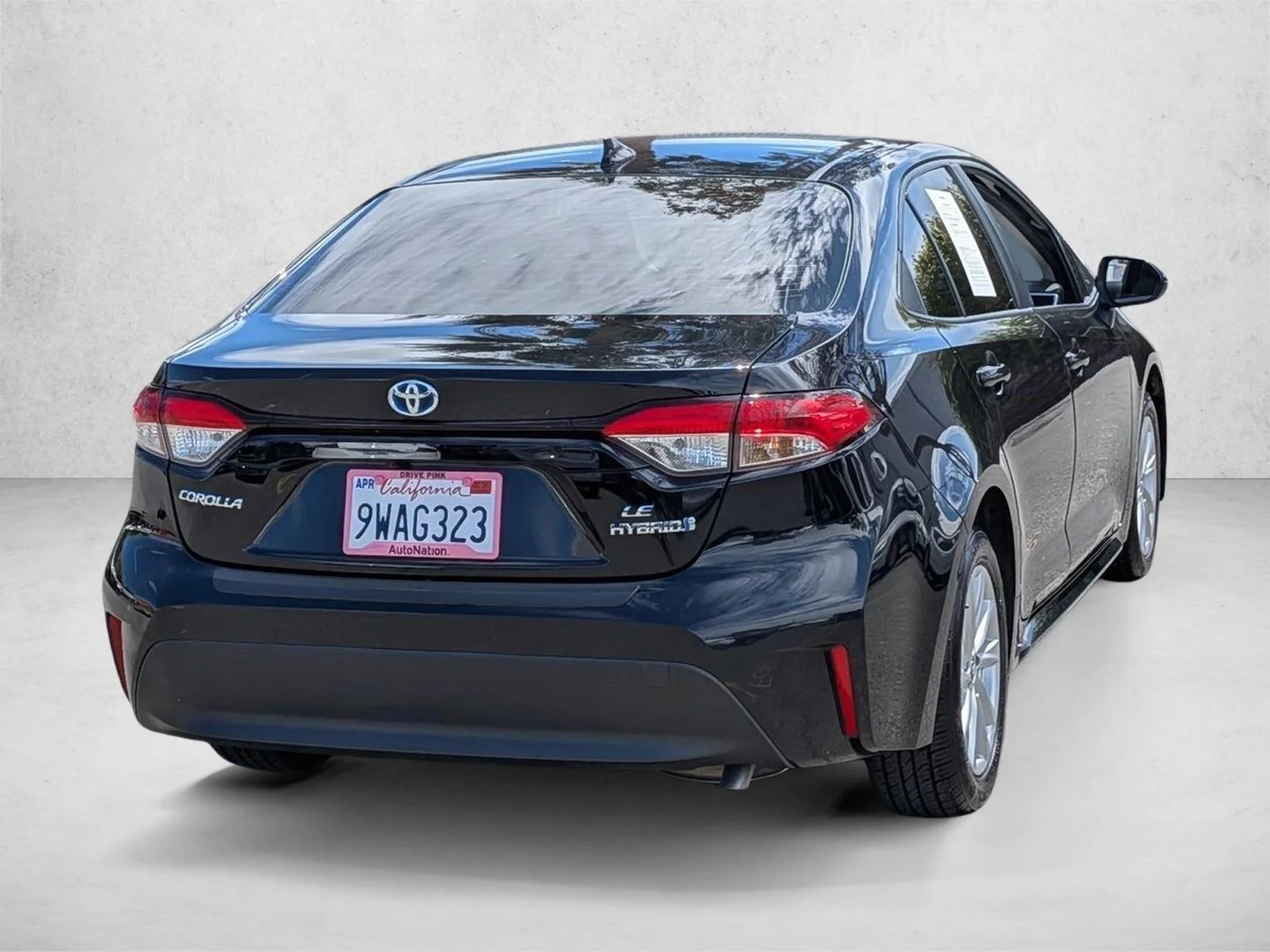 Used 2024 Midnight Black Metallic Toyota Hybrid LE image 5