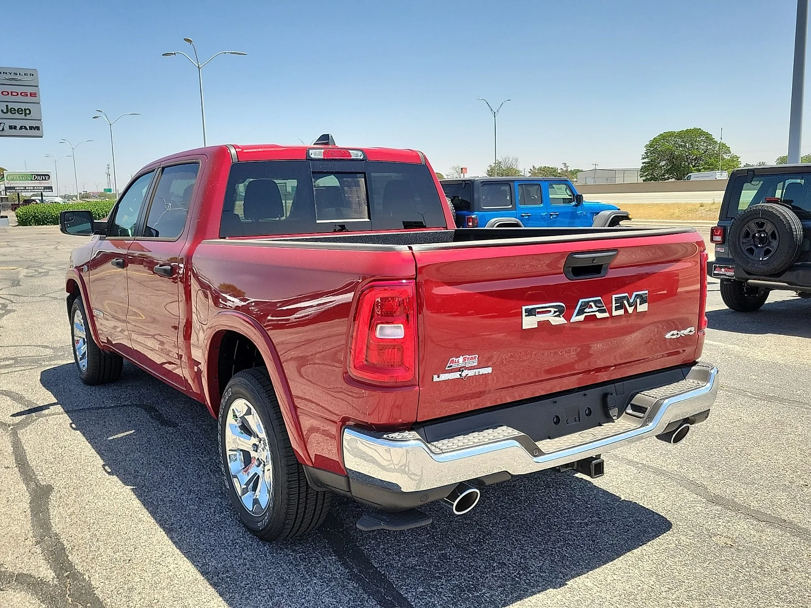 New 2026 Molten Red Pearlcoat Ram LONE STAR CREW CAB 4X4 5