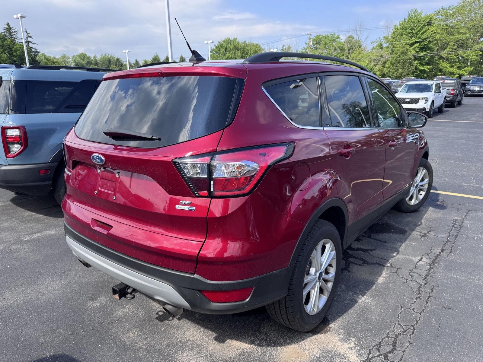 Used 2018 Ruby Red Metallic Tinted Clearcoat Ford SE image 4