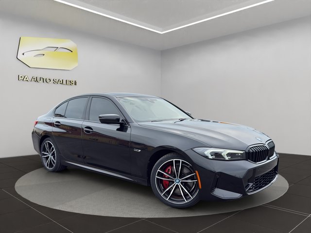 Used 2023 Black Sapphire Metallic BMW 330e xDrive image 1