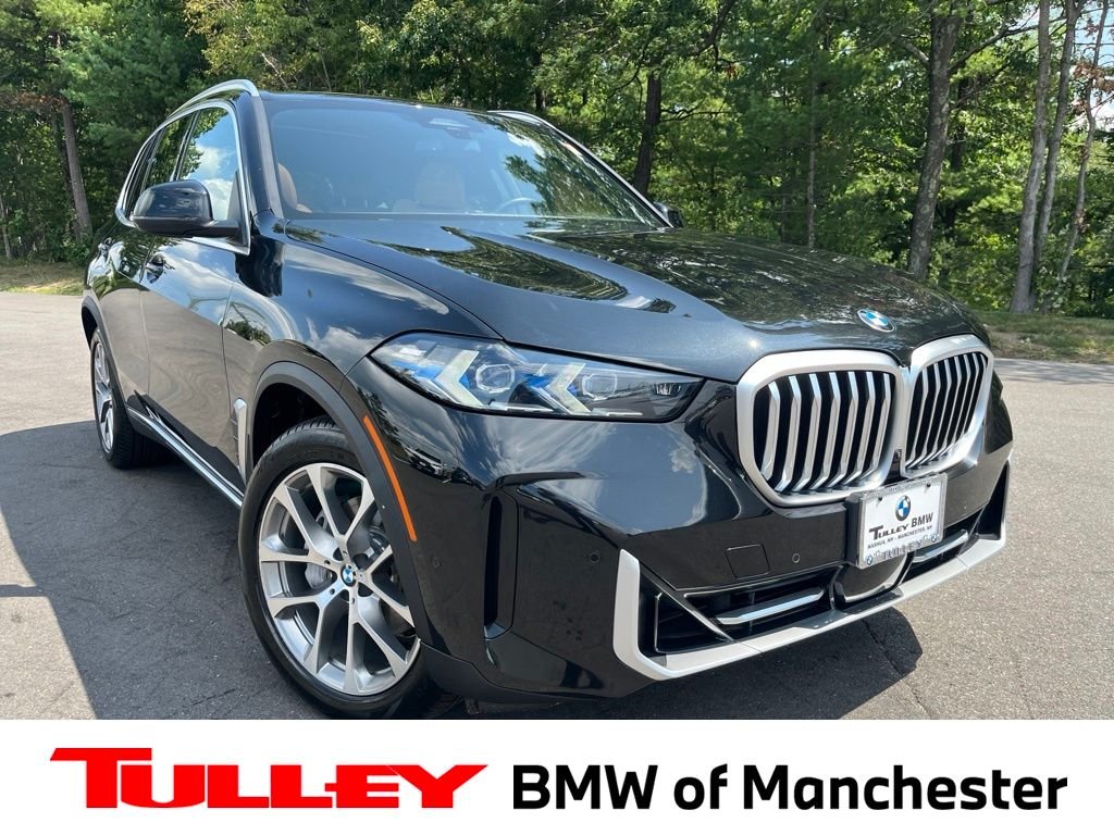 Certified Used 2024 Black Sapphire Metallic BMW xDrive40i image 1