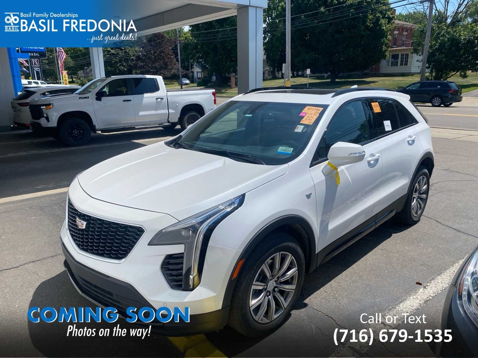 Used 2023 Crystal White Tricoat Cadillac Sport image 1