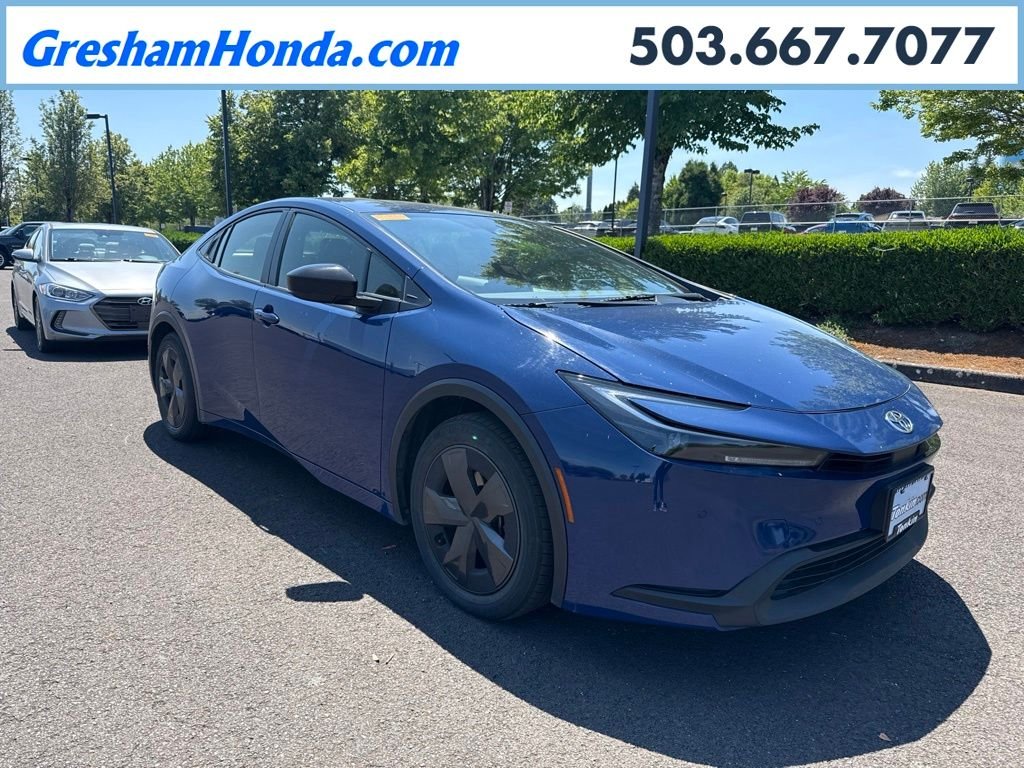 Used 2025 Reservoir Blue Toyota LE image 1