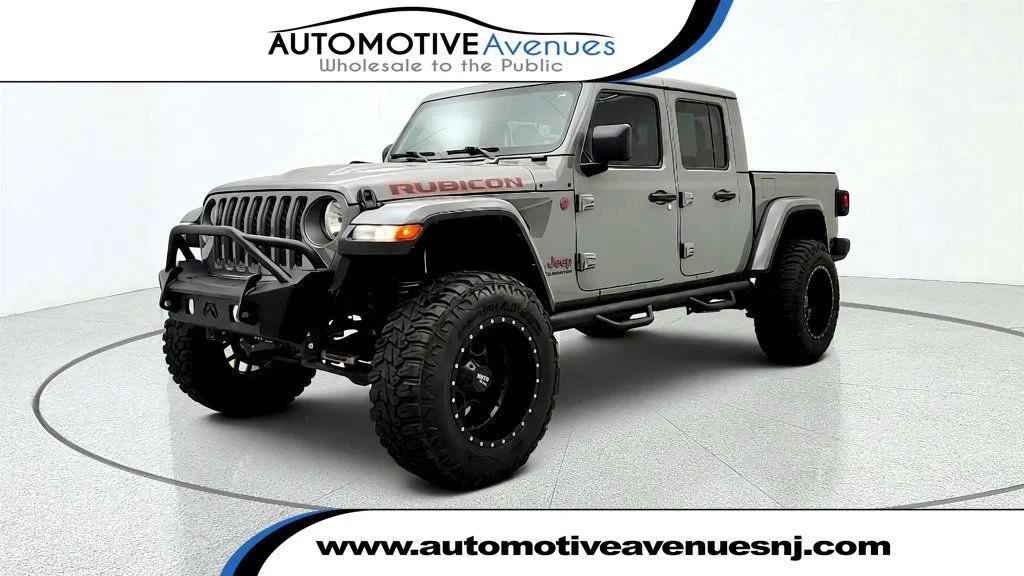 Used 2021 Sting-Gray Clearcoat Jeep Rubicon 4x4 w/ 8-Speed Auto & Freedom Top Hardtop image 1