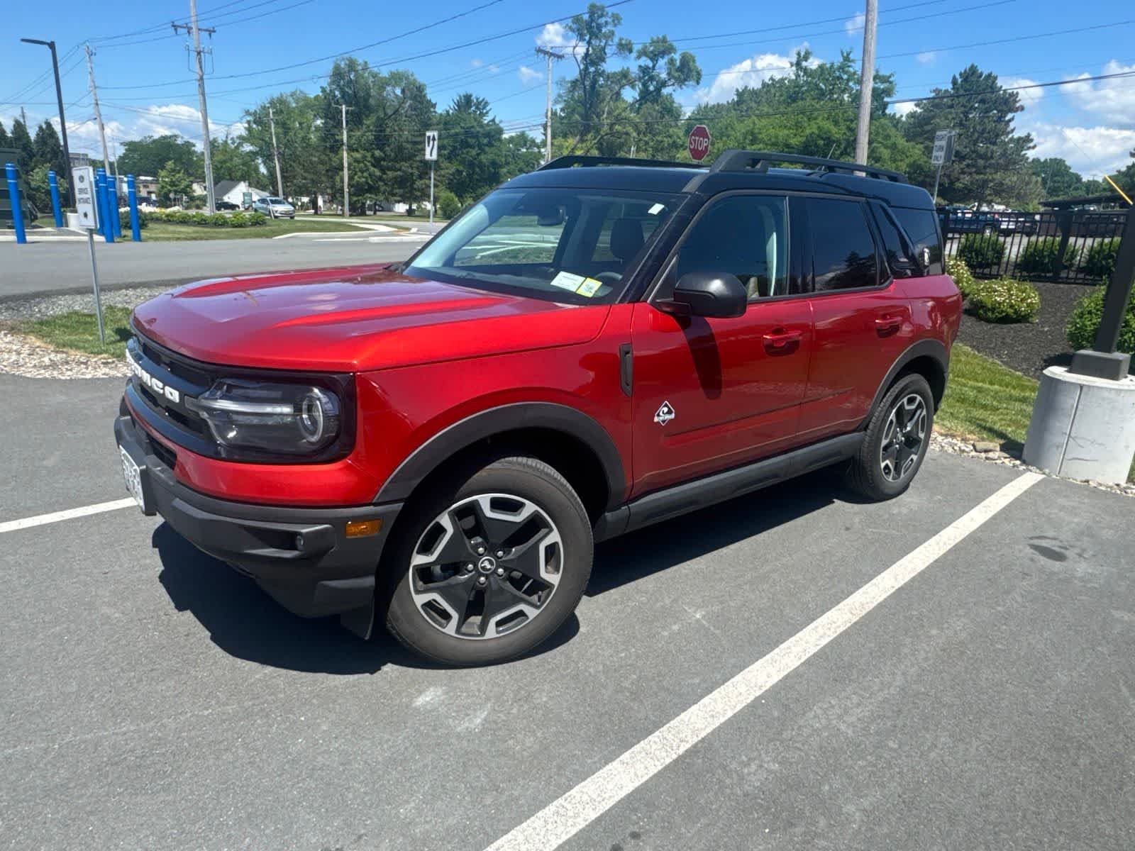 Used 2024 Hot Pepper Red Metallic Tinted Clearcoat Ford Outer Banks image 1