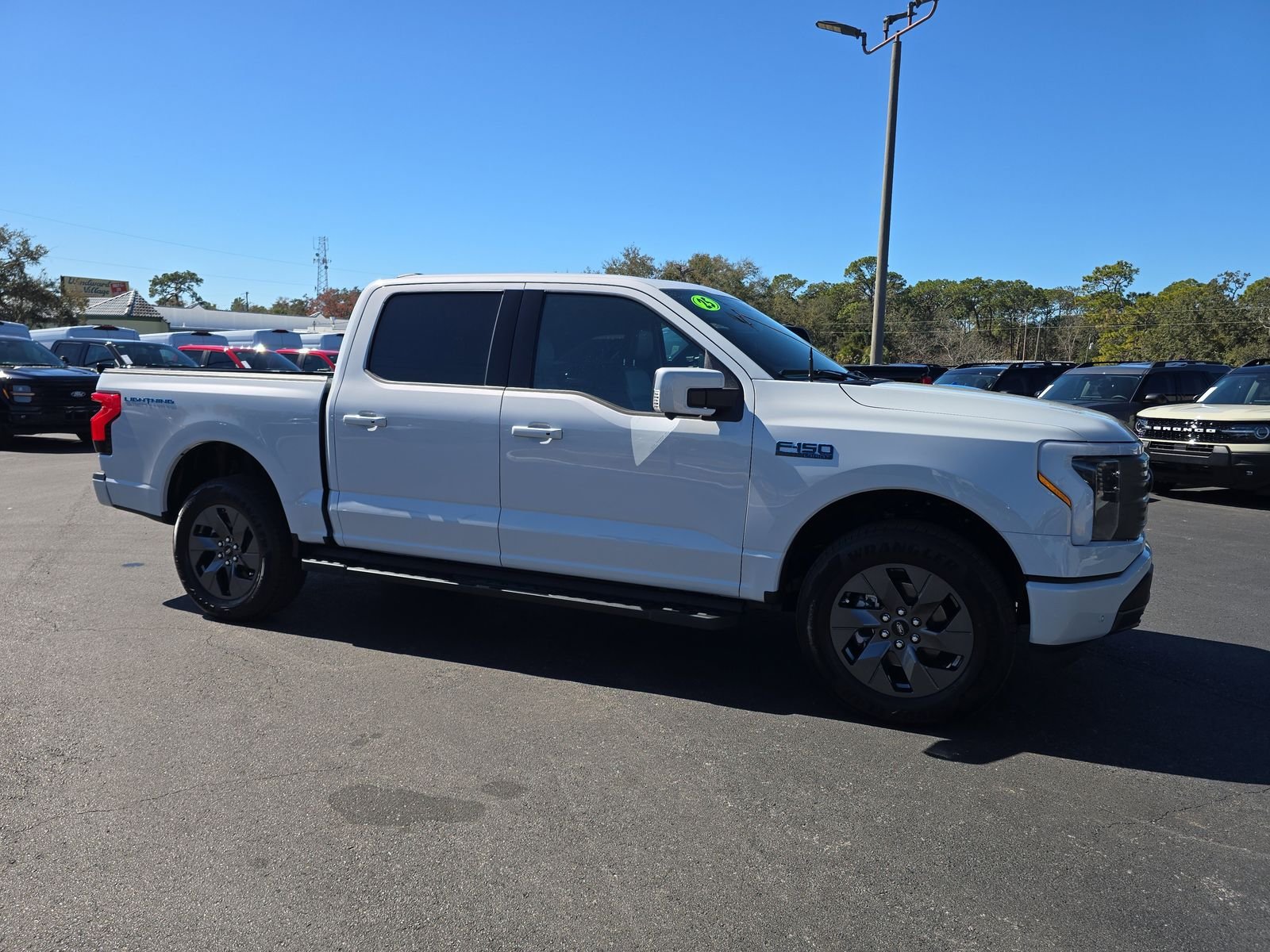 Certified 2025 Ford F-150 Lightning Lariat with VIN 1FT6W5L74SWG06948 for sale in Spring Hill, FL