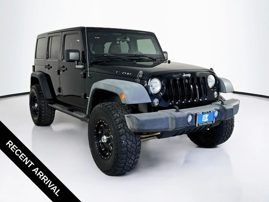 Used 2014 Black Clearcoat Jeep Unlimited Rubicon image 1