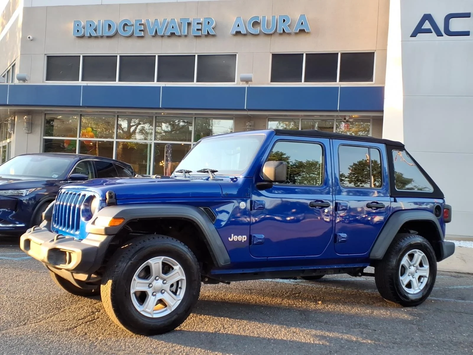 Used 2020 Ocean Blue Metallic Clear Coat Jeep Sport S image 1