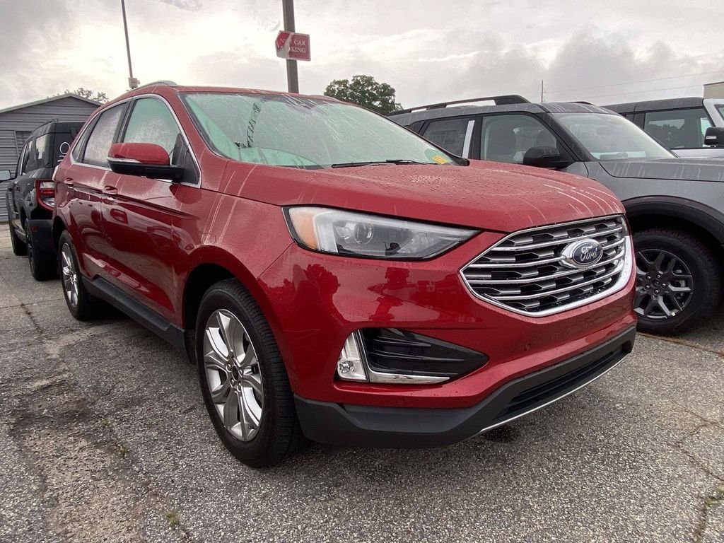 Certified Used 2023 Rapid Red Metallic Tinted Clearcoat Ford Titanium image 1