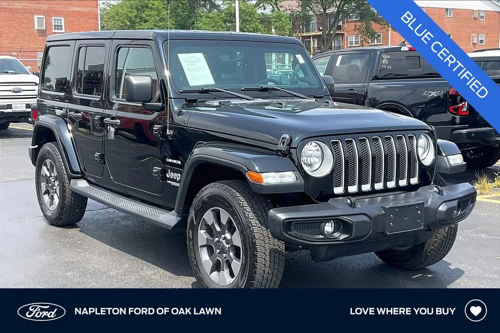 Used 2018 Black Jeep Unlimited Sahara image 1
