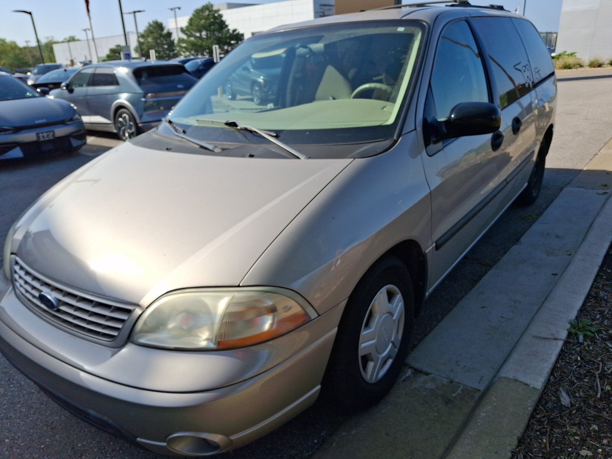 Used 2003 Silver Frost Clearcoat Metallic Ford LX image 1