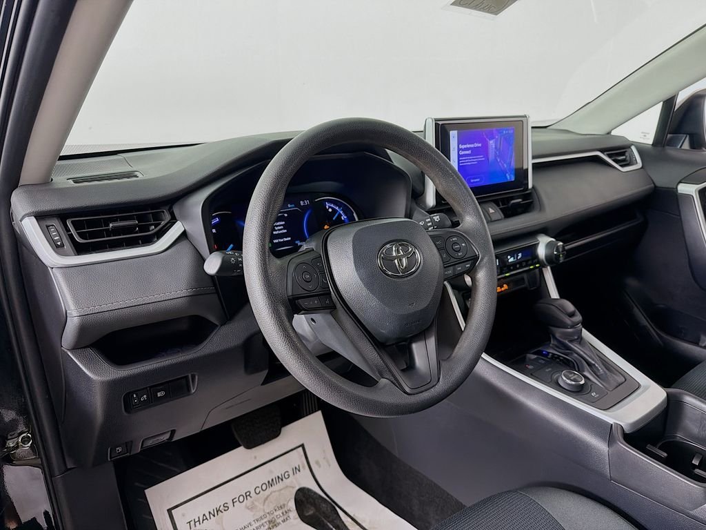 Used 2024 Midnight Black Metallic Toyota Hybrid LE image 9