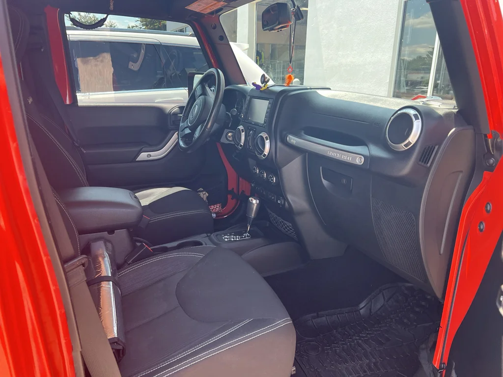Used 2015 Sunset Orange Pearlcoat Jeep Sahara image 8