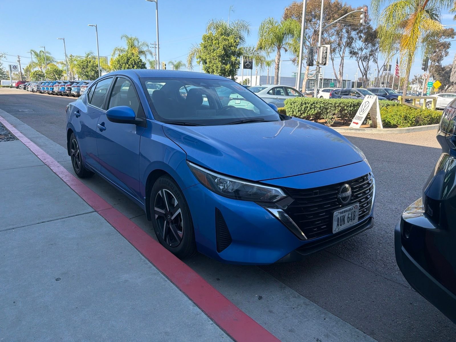 Used 2024 Electric Blue Metallic Nissan SV image 6