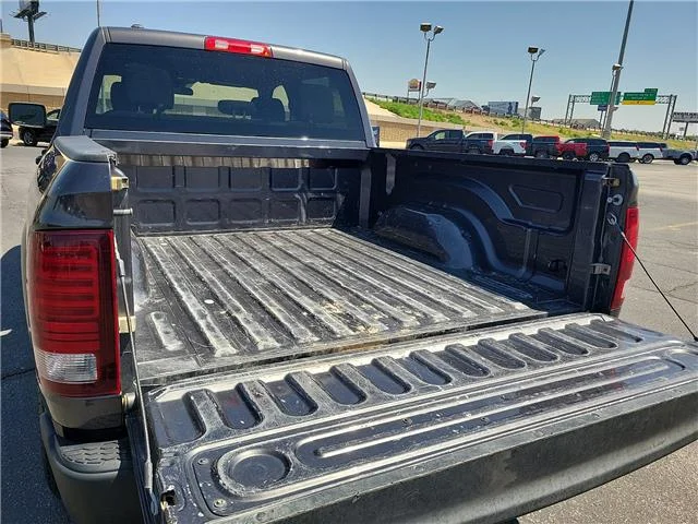 Used 2024 Granite Crystal Metallic Clearcoat RAM SLT 4x2 Crew Cab 5.6 ft. box 140 in. WB image 7