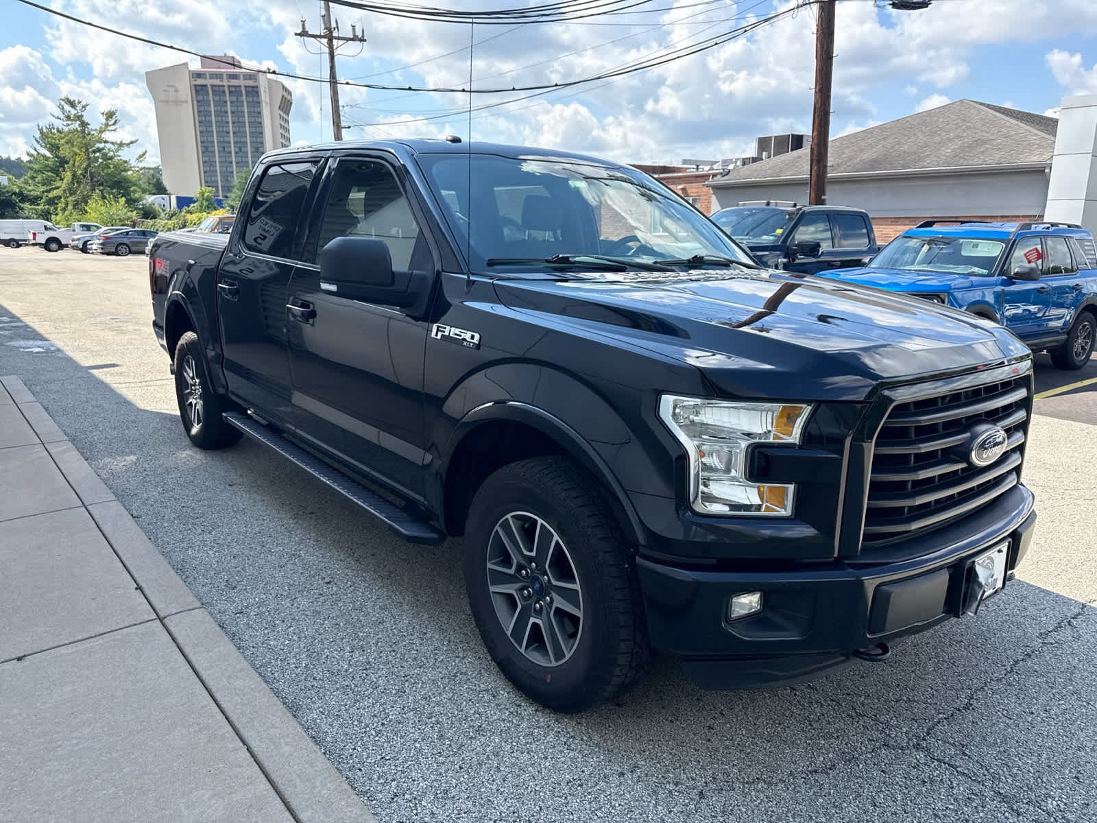 Used 2016 Shadow Black Ford XLT 4WD SuperCrew 145 image 3