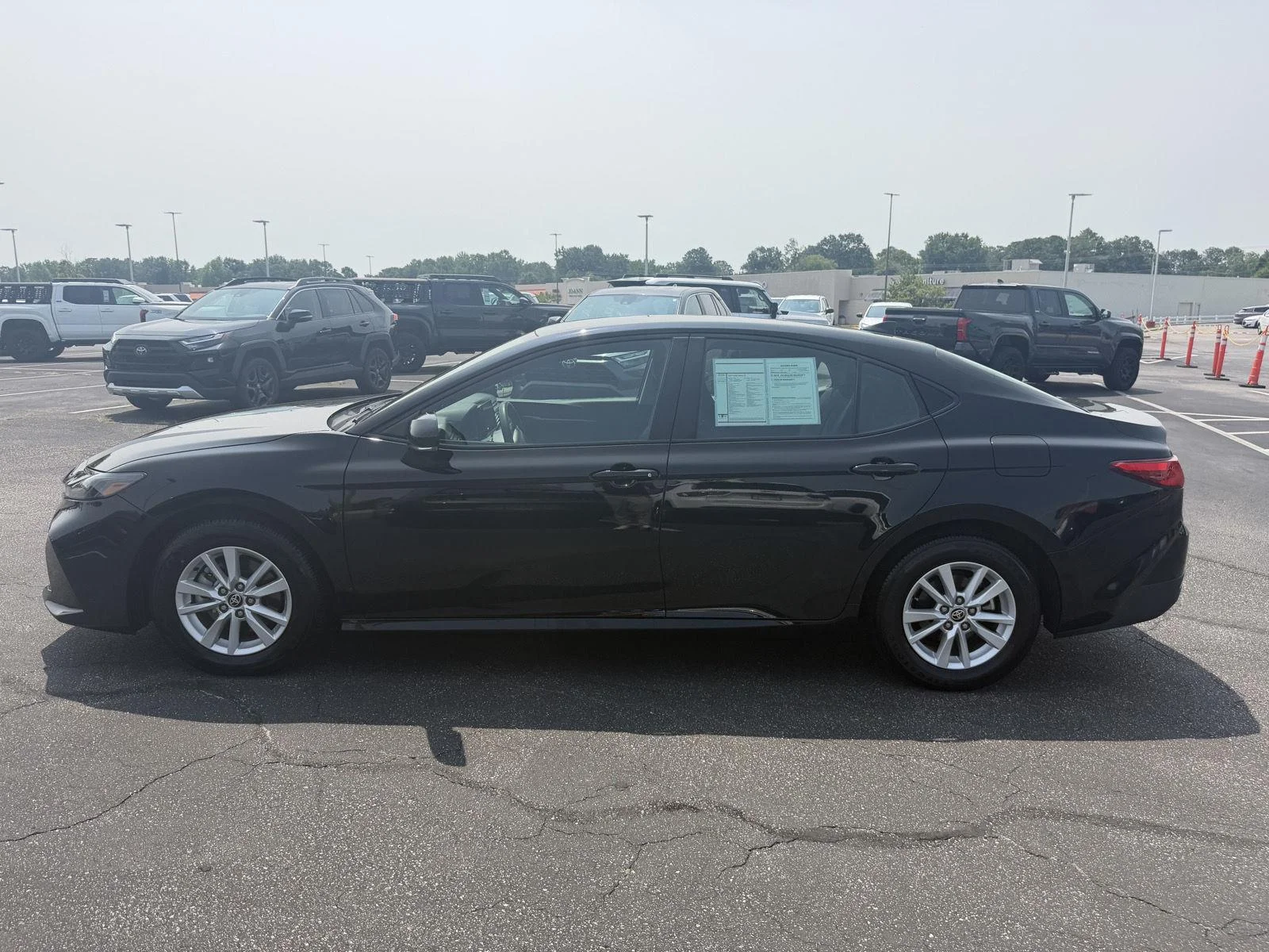 Used 2025 Midnight Black Metallic Toyota LE image 4