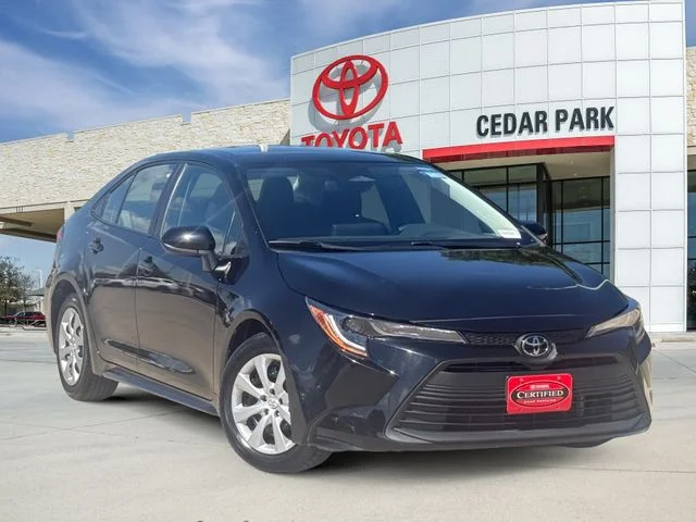 Used 2025 Midnight Black Metallic Toyota LE image 1