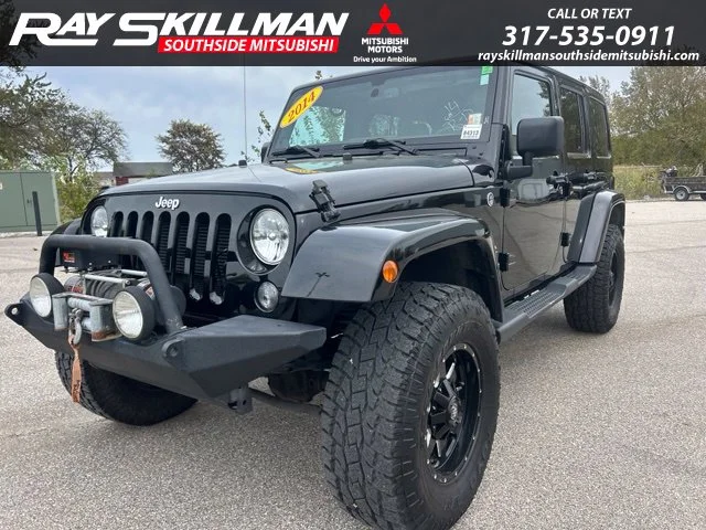 Used 2014 Black Jeep Unlimited Sahara image 1