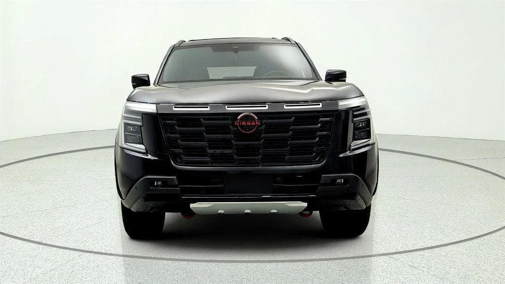 Used 2025 Super Black Nissan 4x4 PRO-4X w/ Cross Bars image 2