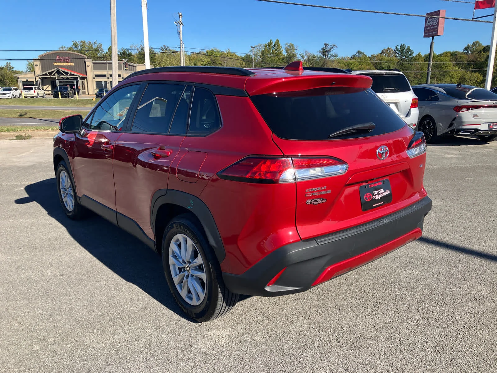 Used 2023 Barcelona Red Metallic Toyota LE image 5