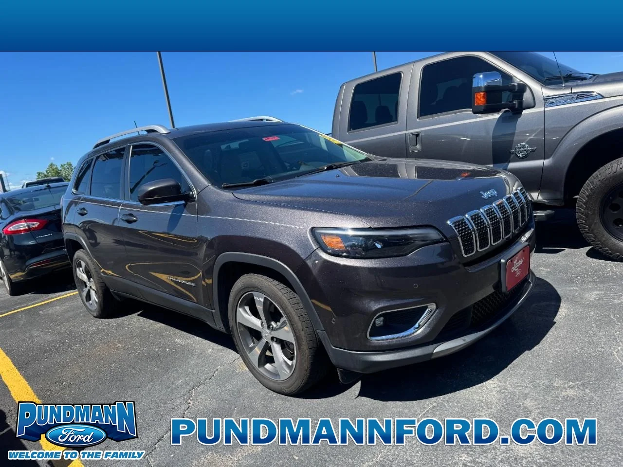 Used 2019 Granite Crystal Clearcoat Metallic Jeep Limited FWD image 1